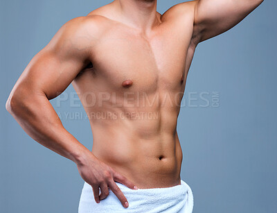 Buy stock photo Cropped shot of an unrecognizable man posing in a towel against a grey background