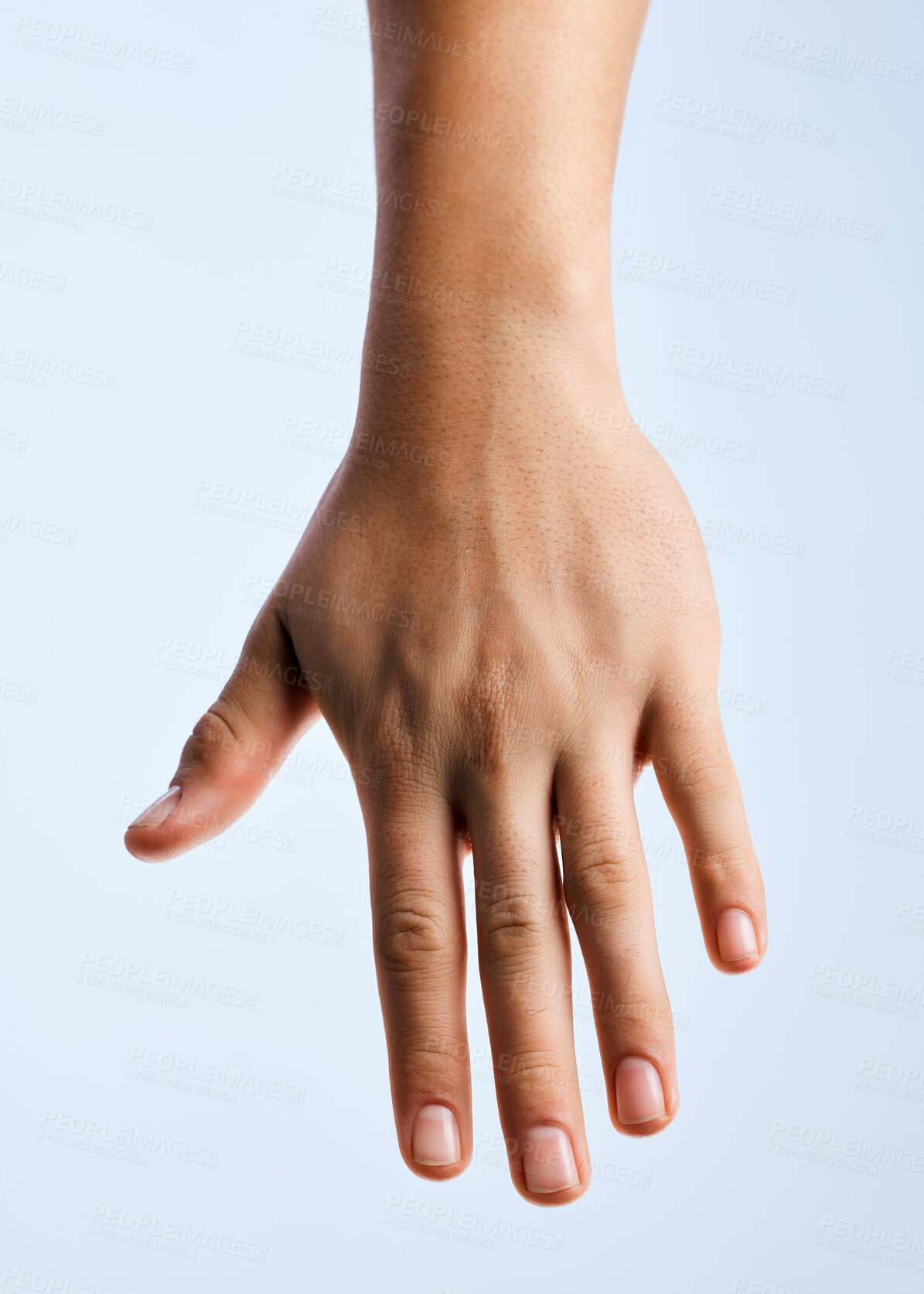 Buy stock photo Shot of an unrecognizable man holding out his hand in a gesture against a white background