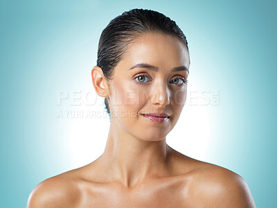 Buy stock photo Shot of a young female standing against a blue background