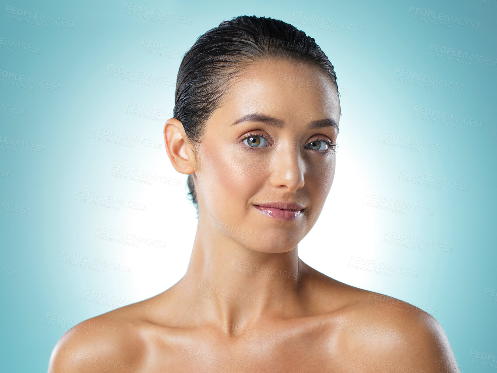 Buy stock photo Shot of a young female standing against a blue background