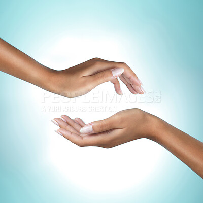 Buy stock photo Shot of a unrecognizable woman's hand against a blue background