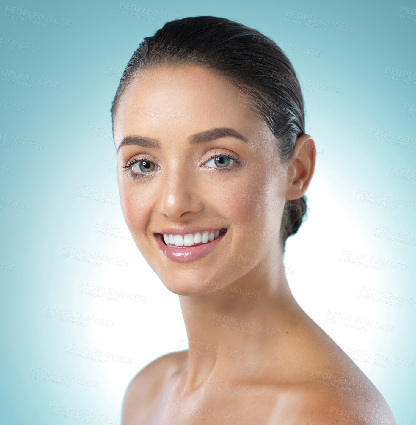 Buy stock photo Shot of a young female standing against a blue background