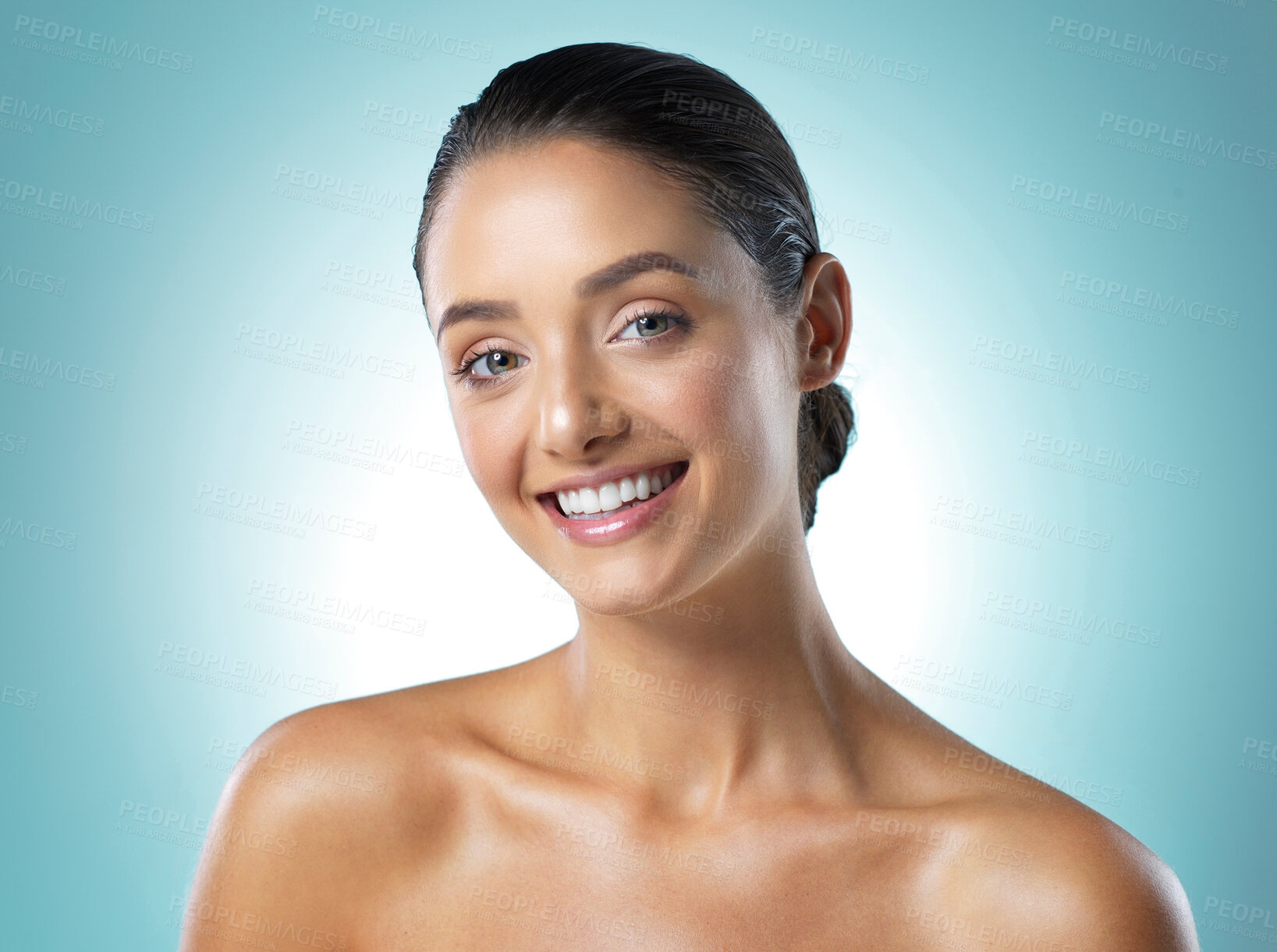 Buy stock photo Shot of a young female standing against a blue background