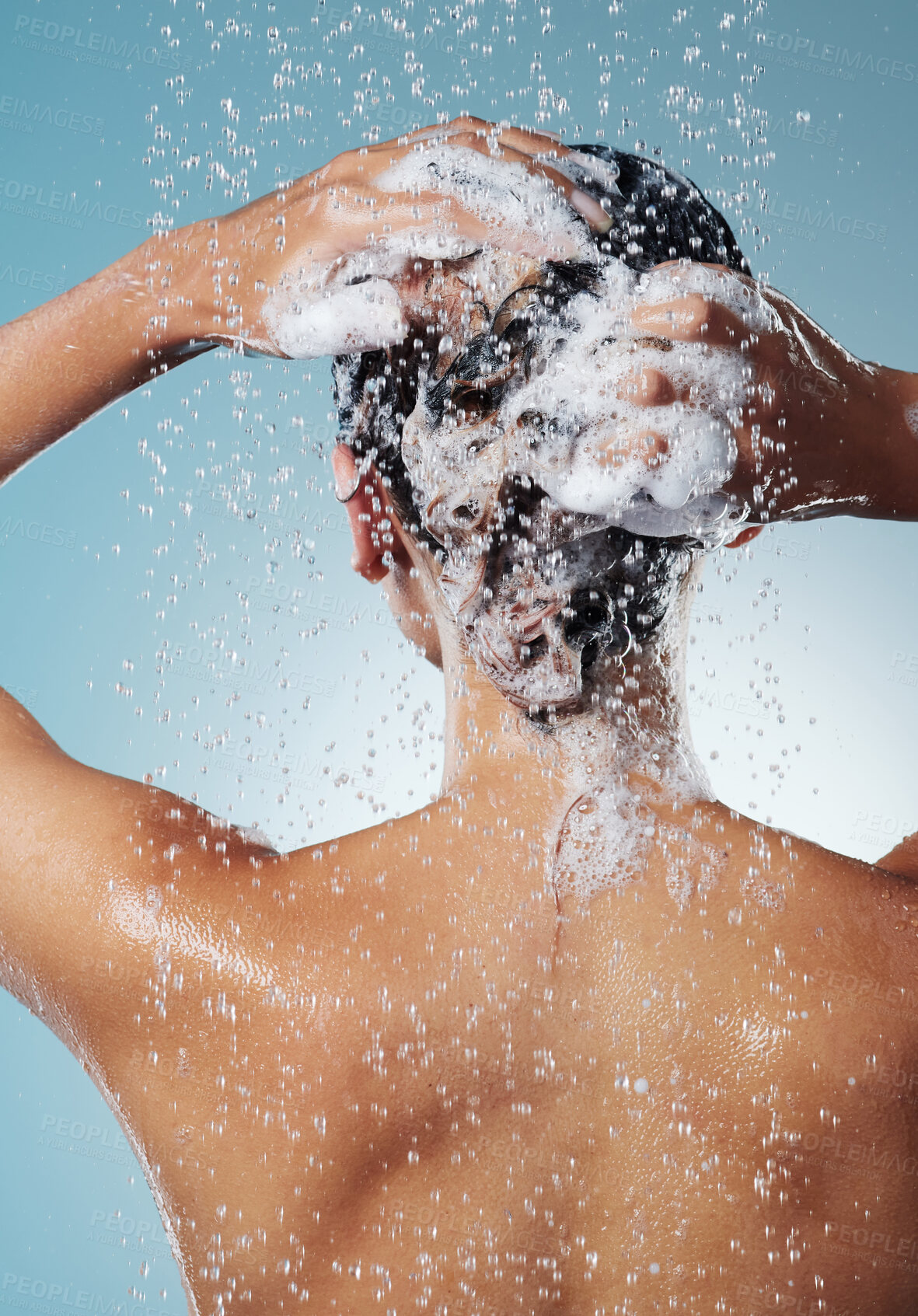 Buy stock photo Shot of an unrecognisable woman washing her hair during her morning shower