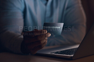 Buy stock photo Shot of a businessman using his bank card to make online payments using his laptop
