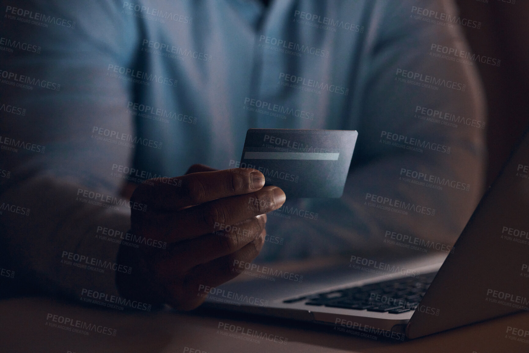 Buy stock photo Shot of a businessman using his bank card to make online payments using his laptop