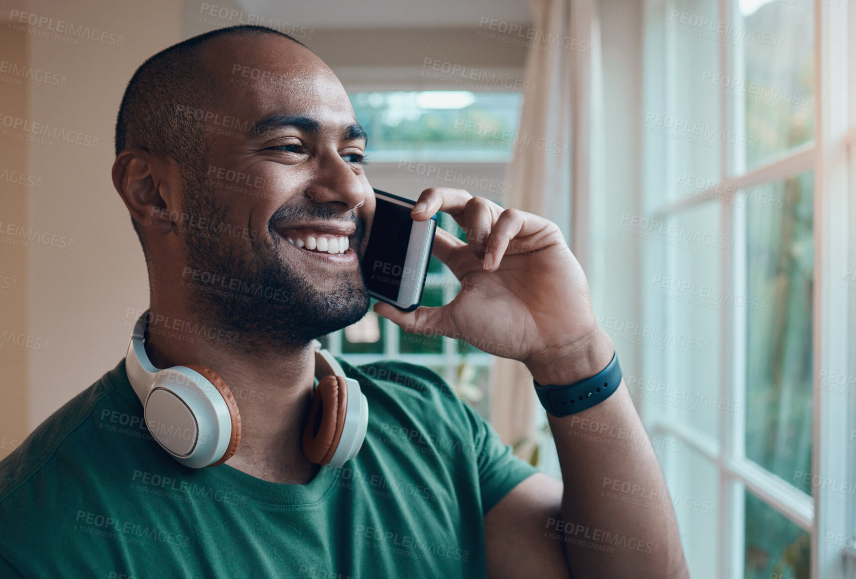 Buy stock photo Man, phone call and happy in home at window for contact, gossip and laugh with funny memory. Person, smile and conversation on mobile network, story or remember with joke in morning at apartment