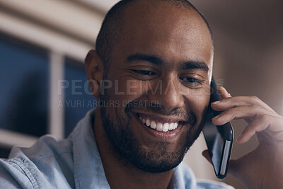Buy stock photo Shot of a young businessman using his smartphone to make a phone call