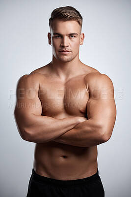 Buy stock photo Portrait, man and bodybuilder with arms crossed on studio background, backdrop and topless abs. Sexy, serious and strong male model, sports athlete and fitness for exercise, confidence and muscles