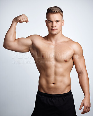Buy stock photo Portrait of man, bodybuilder and bicep flex in studio, background and exercise for muscular power. Strong, sexy and topless male model, sports athlete and pride of arm muscle, fitness results and abs