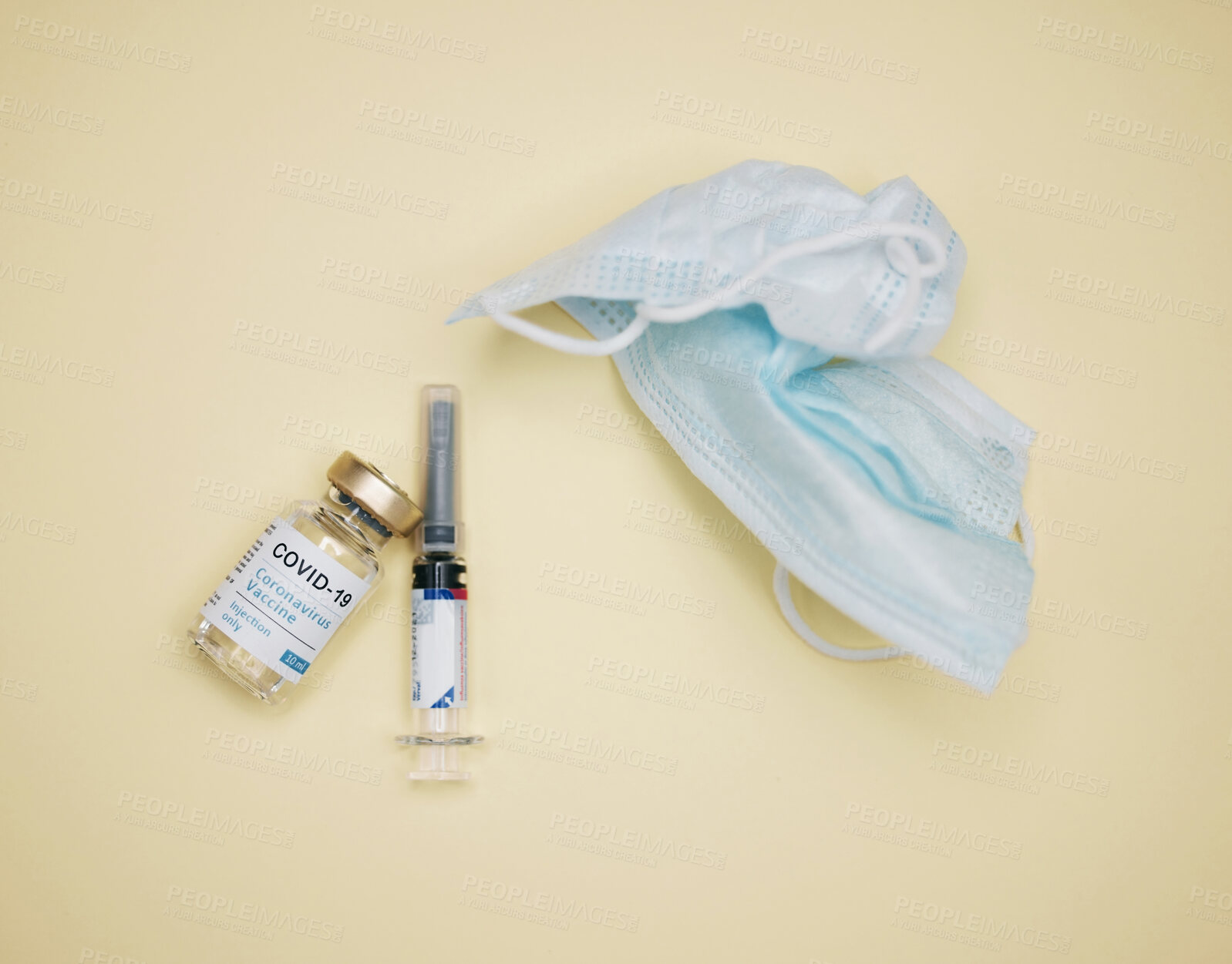 Buy stock photo Syringe, vaccine and mask in studio for health care, safety and protection or to prevent spread of covid virus. Medical, vial and needle with liquid or drugs for research, development and wellness