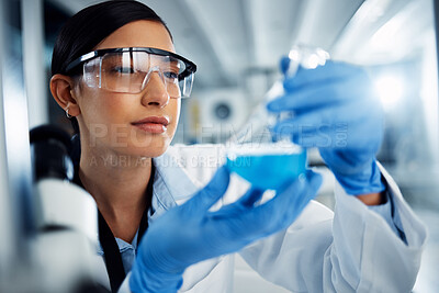 Buy stock photo Woman, scientist and study chemical liquid, glass beaker and science chemistry experiment in lab. Female doctor with goggles, gloves and analysis of fluid, scientific innovation and medical research