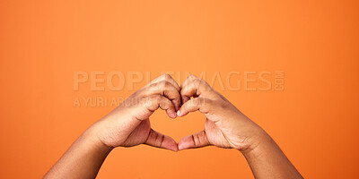 Buy stock photo Love, hands and heart shape in studio for care, support and romance on orange background. Person, symbol and icon for affection with emoji, trust and peace for valentines day with mockup space