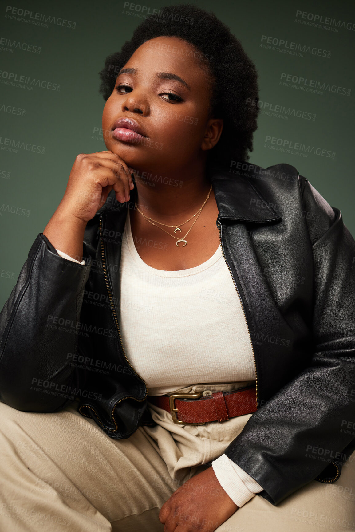 Buy stock photo Portrait, African woman and pride in studio for fashion, style and confidence on green backdrop. Female person, face and leather jacket for plus size, attitude and trendy outfit by background