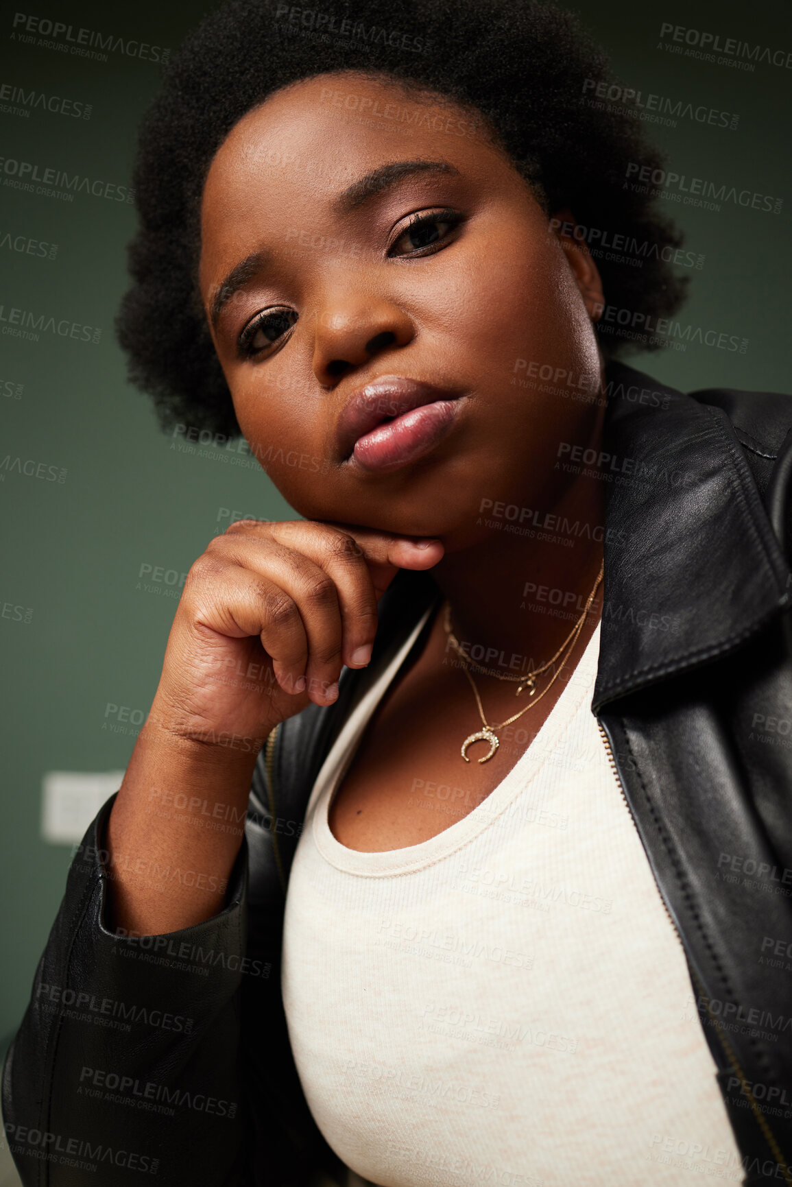 Buy stock photo Portrait, African woman and plus size in studio for fashion, style and pride on green backdrop. Female person, face and leather jacket for confidence, attitude and trendy outfit by background  