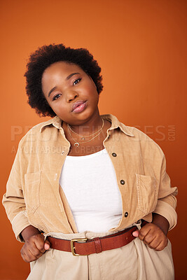 Buy stock photo Black woman, serious and fashion portrait in studio with confidence to promote plus size aesthetic, trending and clothing. African person, designer and isolated with stylish handmade outfit and pout.