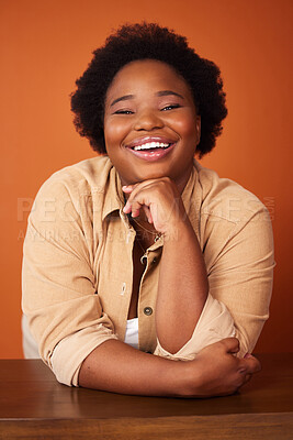 Buy stock photo Black woman, lean and desk with portrait in studio for fashion with confidence as plus size model to promote stylish or trendy clothing. Person, happiness and designer isolated with aesthetic outfit.