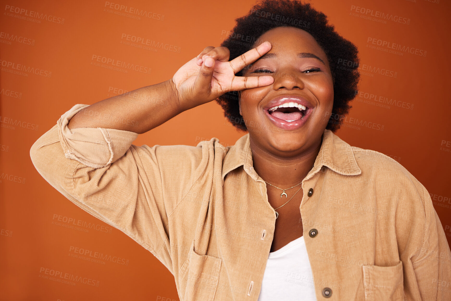 Buy stock photo Smile, peace sign and portrait of black woman in studio for fashion with confidence as plus size model. Happy, hand gesture or African girl designer isolated with trendy clothing or aesthetic outfit