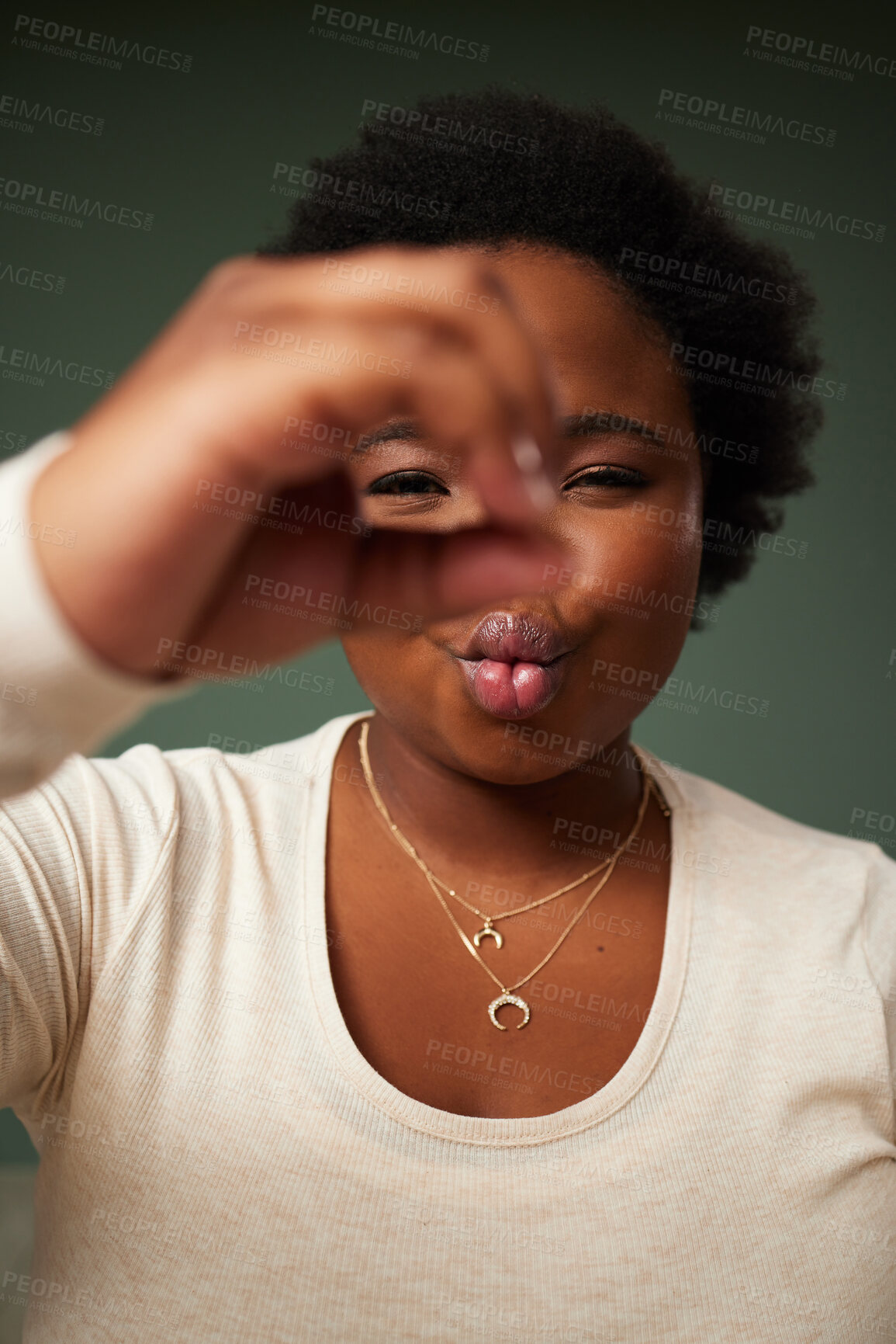 Buy stock photo Circle, hand and black woman portrait in studio with pout for fun picture, attitude and lens on green background. Face, lady and beauty influencer with emoji finger for social media or selfie