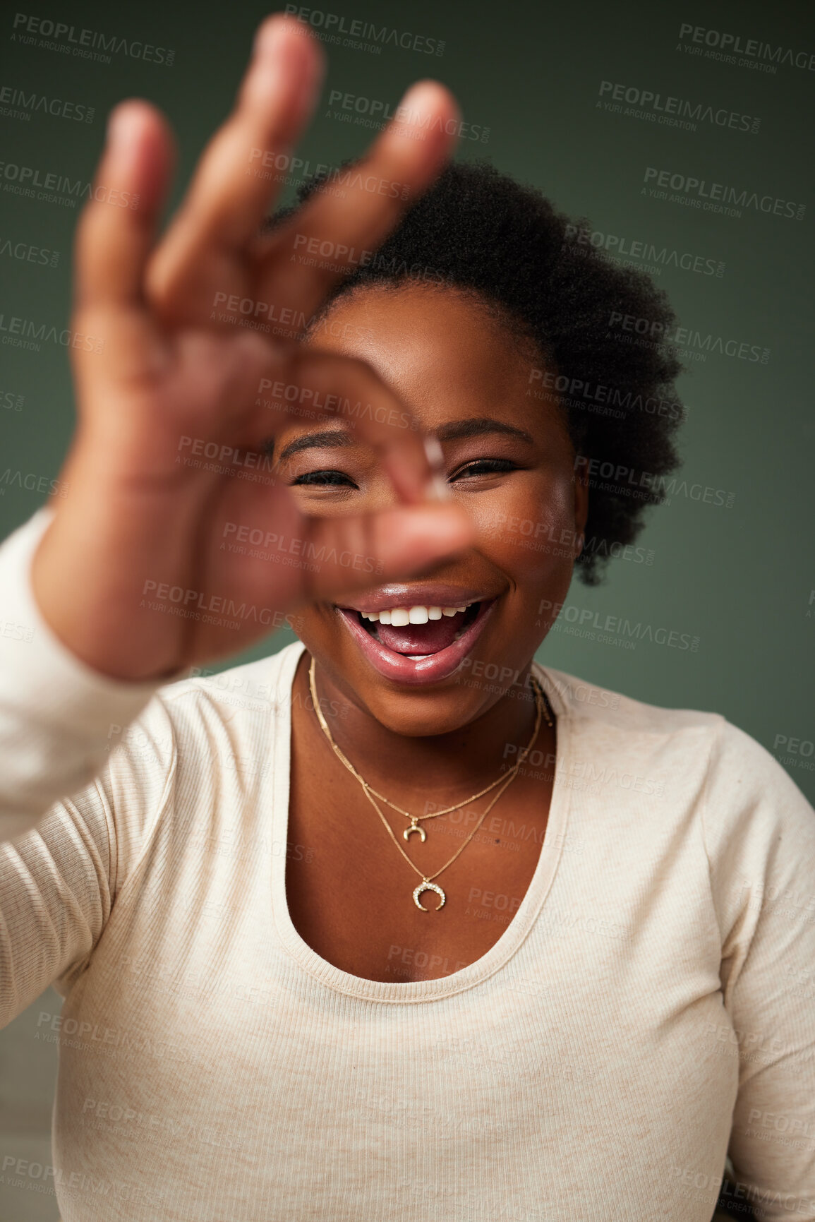 Buy stock photo Okay sign, eye and black woman portrait in studio with smile for approval, attitude or happy on green background. Face, lady or beauty influencer with emoji finger for social media or gesture