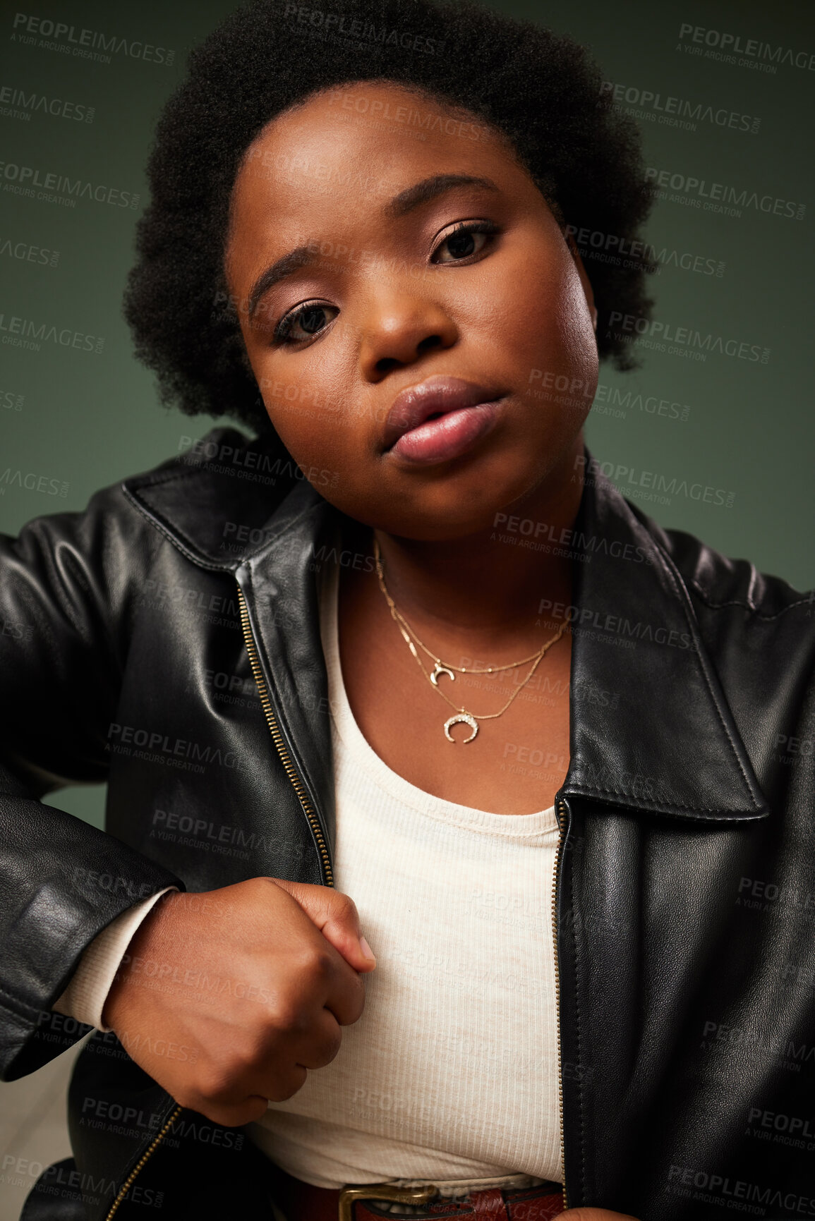 Buy stock photo African woman, portrait and pride for plus size fashion by green background with leather jacket. Confidence, female person and edgy clothes for aesthetic, designer and trendy with attitude in studio