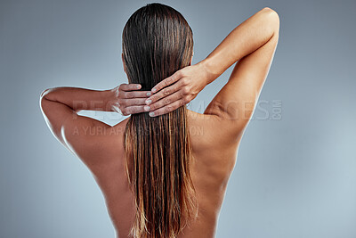 Buy stock photo Hair care, beauty and back of woman in a studio with a clean, long and wet hairstyle with conditioner. Health, wellness and female model with a keratin or salon treatment isolated by gray background.