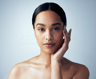 Buy stock photo Skincare, portrait and woman in studio for natural, cosmetic and dermatology on grey background. Face, beauty and female model touching soft, smooth and glowing skin after luxury self care routine