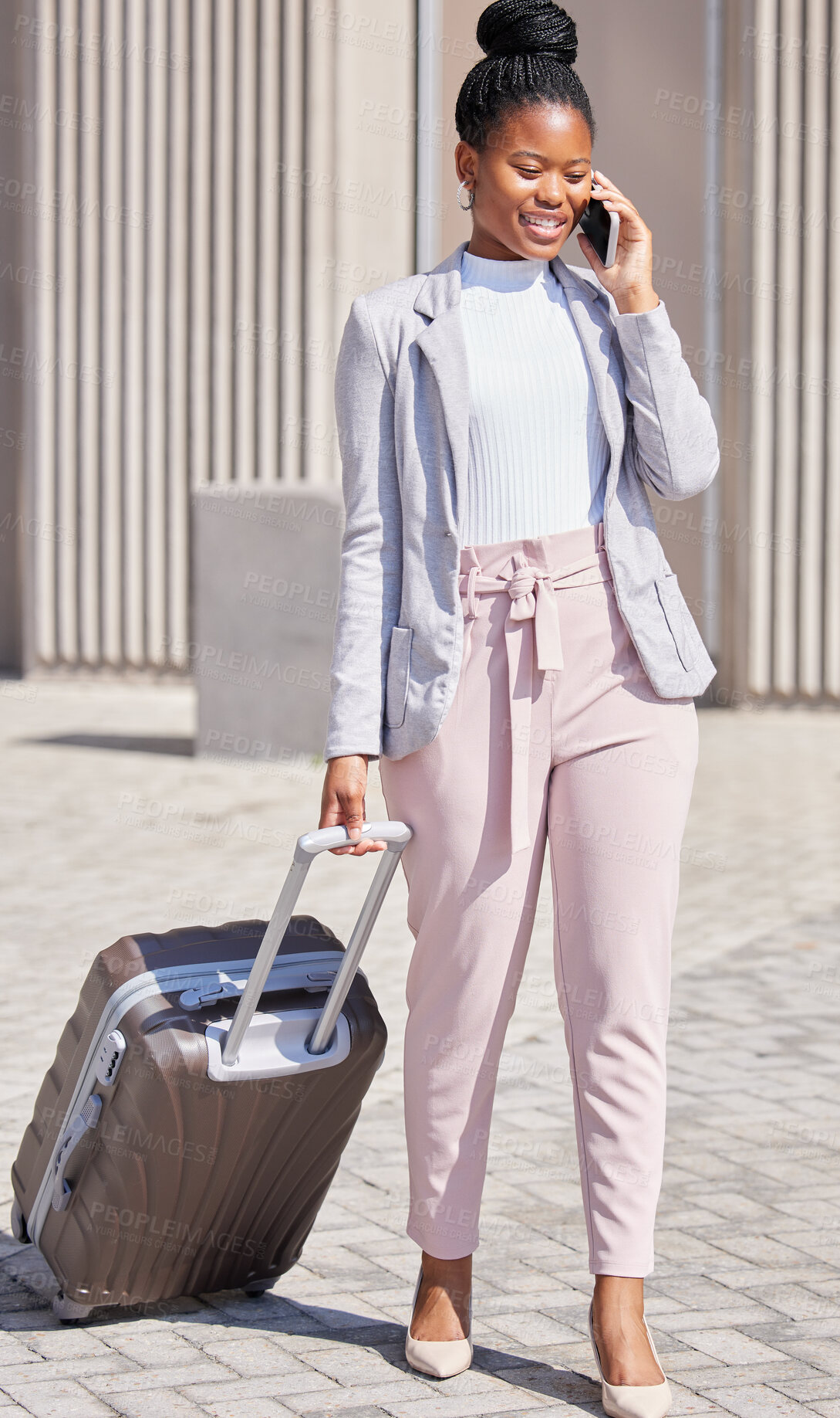 Buy stock photo Shot of a young businesswoman making a phone call using her smartphone