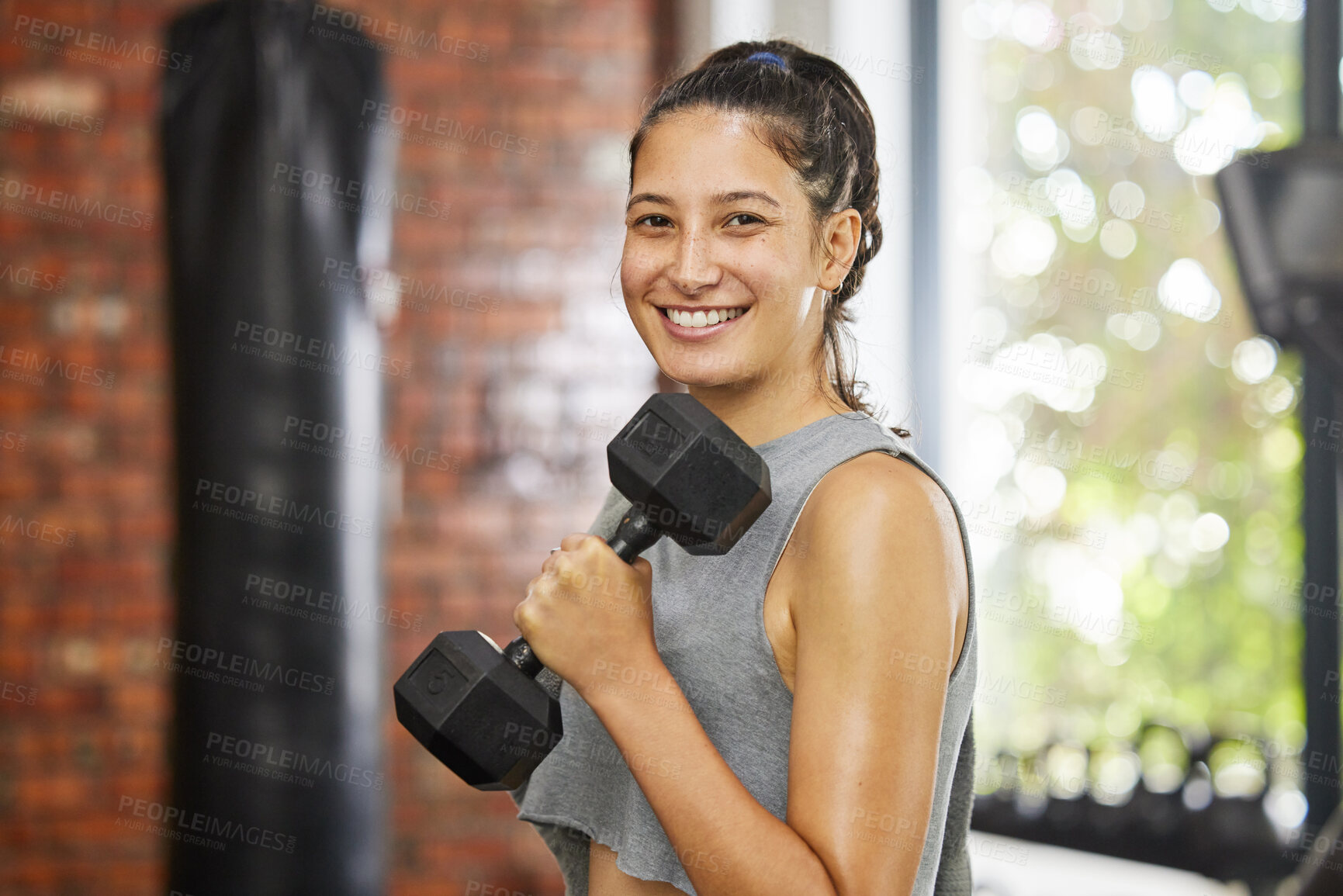 Buy stock photo Woman, workout and portrait in gym with dumbbell, exercise and body health for athlete and empowerment. Happy, power and sport training for wellness, strength and smile in fitness club for confidence