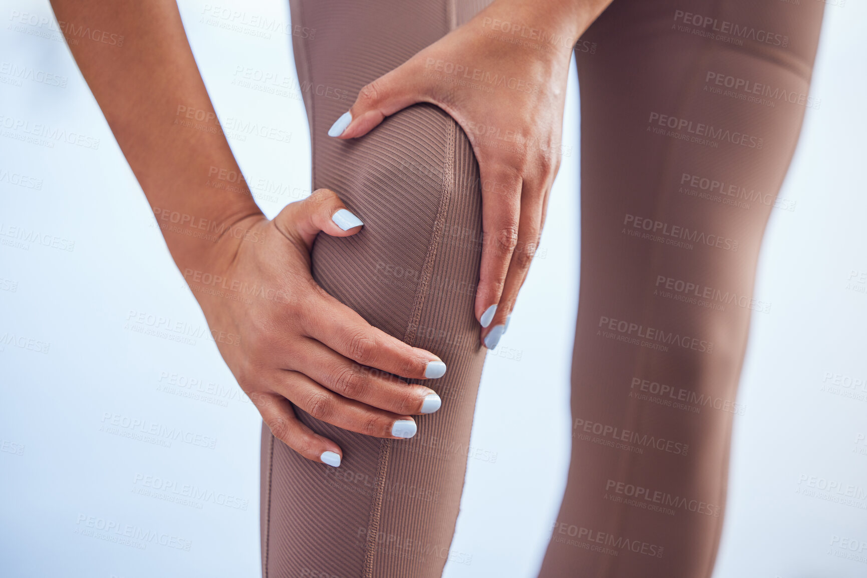 Buy stock photo Fitness, hands and knee injury with sports person closeup outdoor for running accident, emergency or mistake. Fail, gym and pain with woman or runner holding joint in agony on wall background