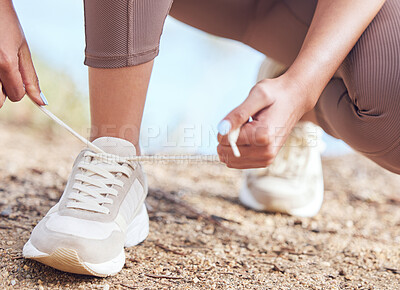 Buy stock photo Fitness, person and hands tie shoes before workout for cardio, running or marathon training. Wellness, feet and legs of runner for prepare, fasten sneakers or ready to start morning jog outdoor