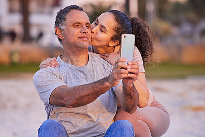 Buy stock photo Beach, selfie or phone with a woman kissing her dad while bonding together by the sea on summer vacation. Travel, family or love with an old man and daughter posing for a social media profile picture