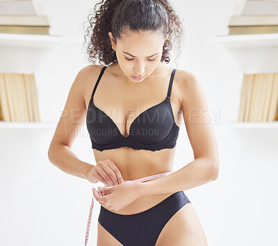 Buy stock photo Woman, lingerie and body positivity for weight loss, diet and pressure with measuring tape on waist. Female person, self esteem and wellness for mental health, care and goal for confidence or beauty