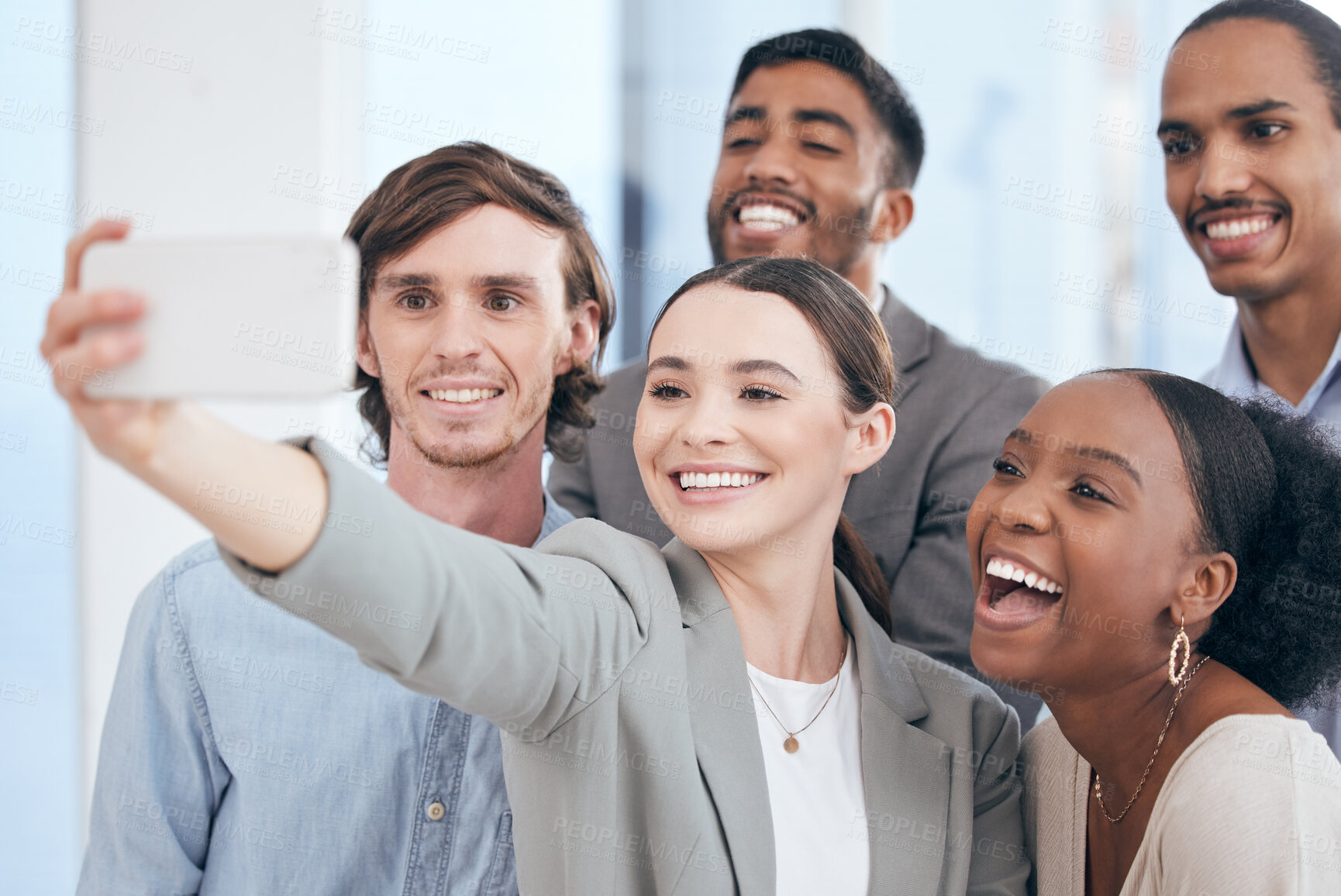 Buy stock photo Shot of a group of businesspeople taking a selfie at work