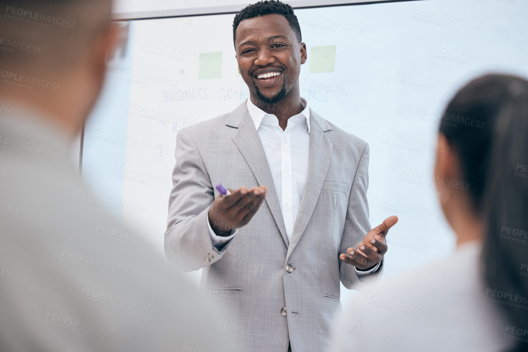 Buy stock photo Planning, portrait of businessman with presentation and with colleagues happy in a conference room. Business, seminar and black man speaker giving speech to coworkers in boardroom of their workplace