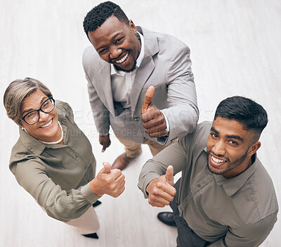 Buy stock photo Top view, thumbs up and portrait with business people for agreement, partnership and diversity in the workplace. Trust, support and affirmative action with feedback, review and vote with hand gesture