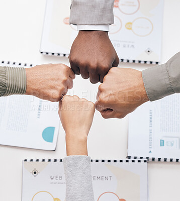Buy stock photo Fist bump, deal or business people in meeting with teamwork for mission, collaboration or community. Hands, group partnership or above of designers with support, portfolio or project documents