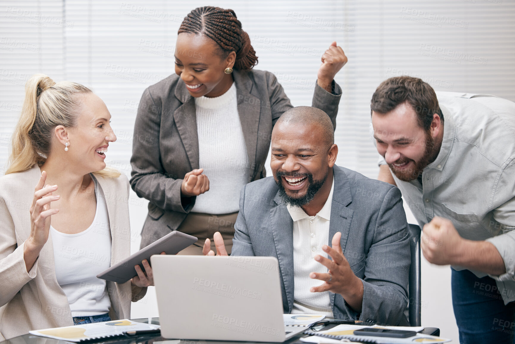 Buy stock photo Cropped shot of a group of white collar businesspeople cheering while gathered around a laptop in the boardroom