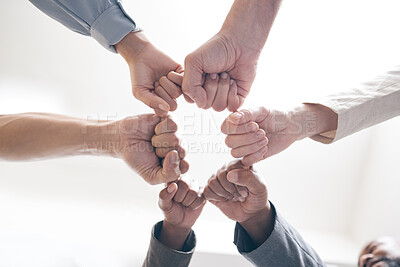 Buy stock photo Hands, business people and fist in circle, office and team building for solidarity in low angle. Colleagues, unity and connect for support or trust at work, white background and staff community