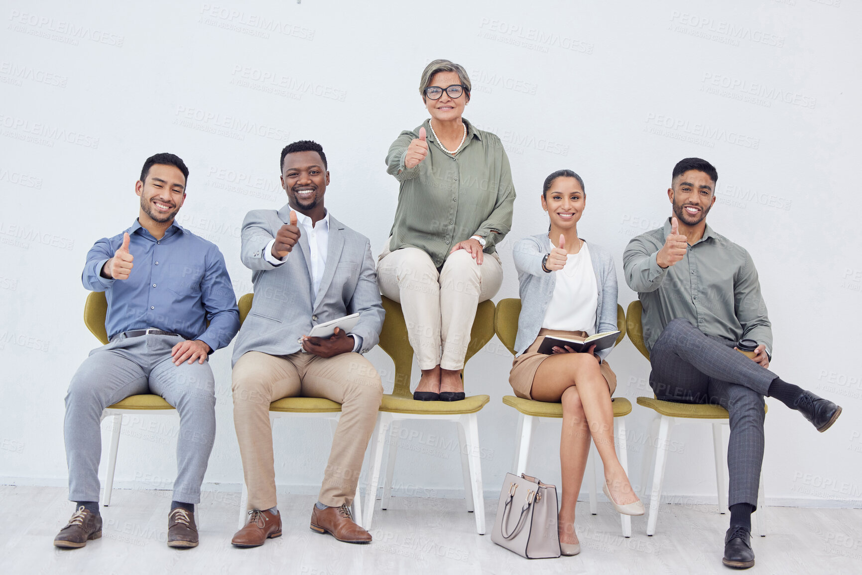 Buy stock photo Mature woman, group and thumbs up for recruitment, selection or job opportunity with technology and notebook. Diversity, people and candidates in business, corporate or hiring for employment contract