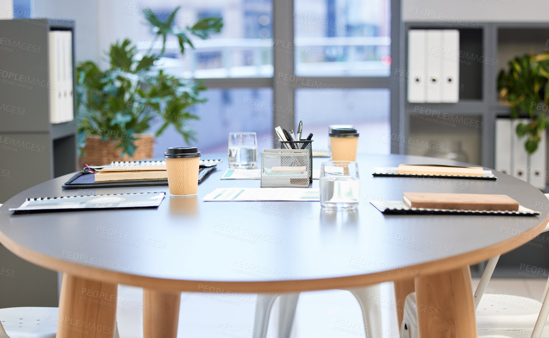 Buy stock photo Shot of a well-lit modern office boardroom with nobody in it