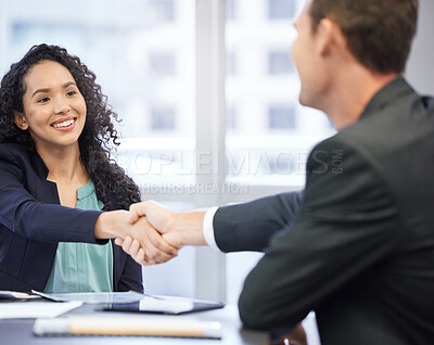 Buy stock photo Cropped shot of an attractive young businesswoman shaking hands with a male colleague during a meeting in the boardroom