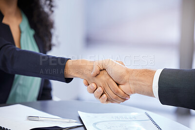 Buy stock photo Cropped shot two unrecognizable businesspeople shaking hands during a meeting in the boardroom