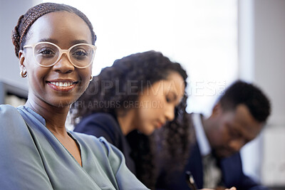 Buy stock photo Cropped portrait of an attractive young businesswoman sitting in the boardroom with her colleagues during a meeting
