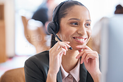 Buy stock photo Cropped shot of an attractive young female call center agent working at her desk in the office