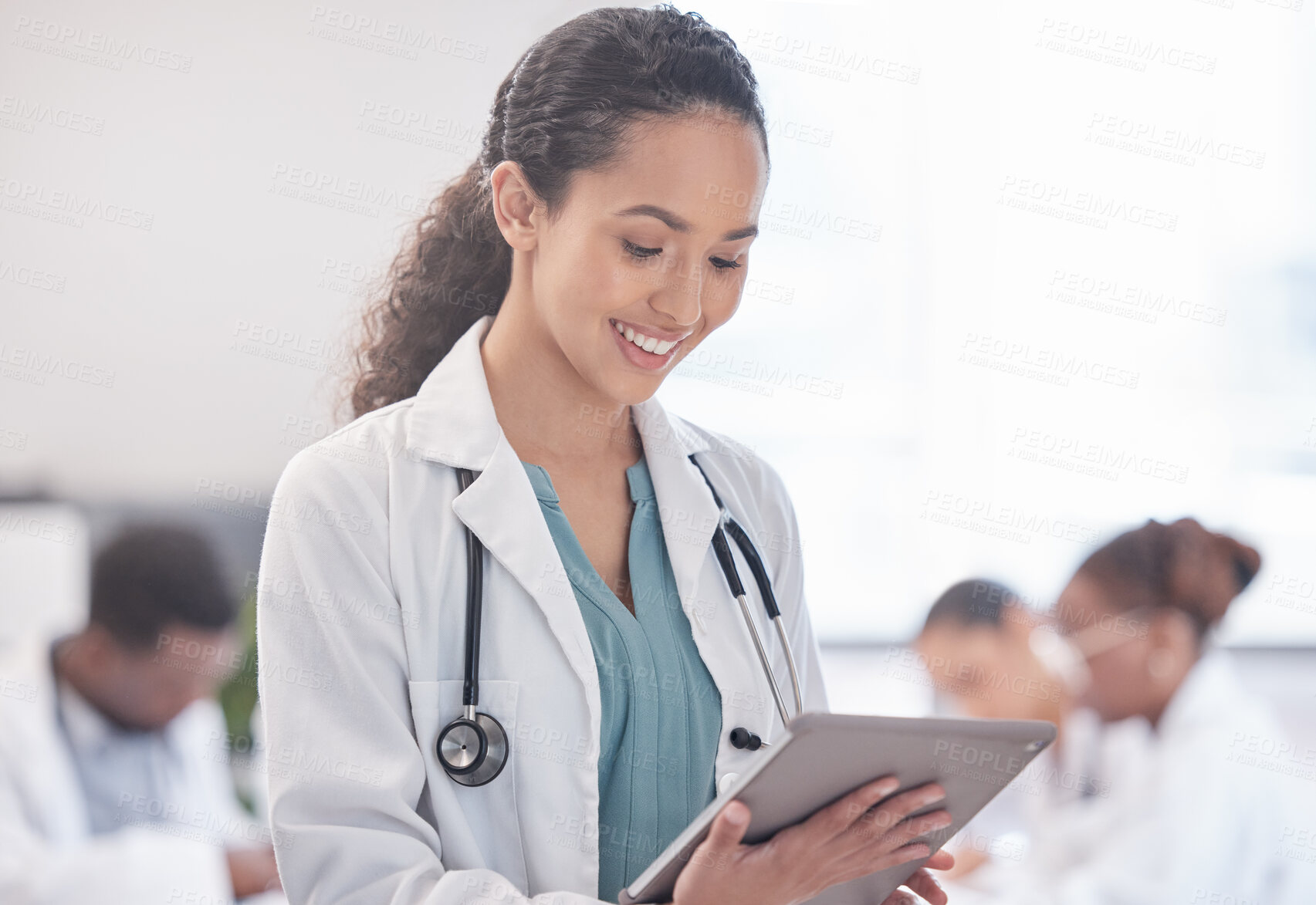 Buy stock photo Happy woman, doctor and research with tablet for browsing, news or medical information at hospital. Female person or healthcare employee with smile on technology for Telehealth or online discovery