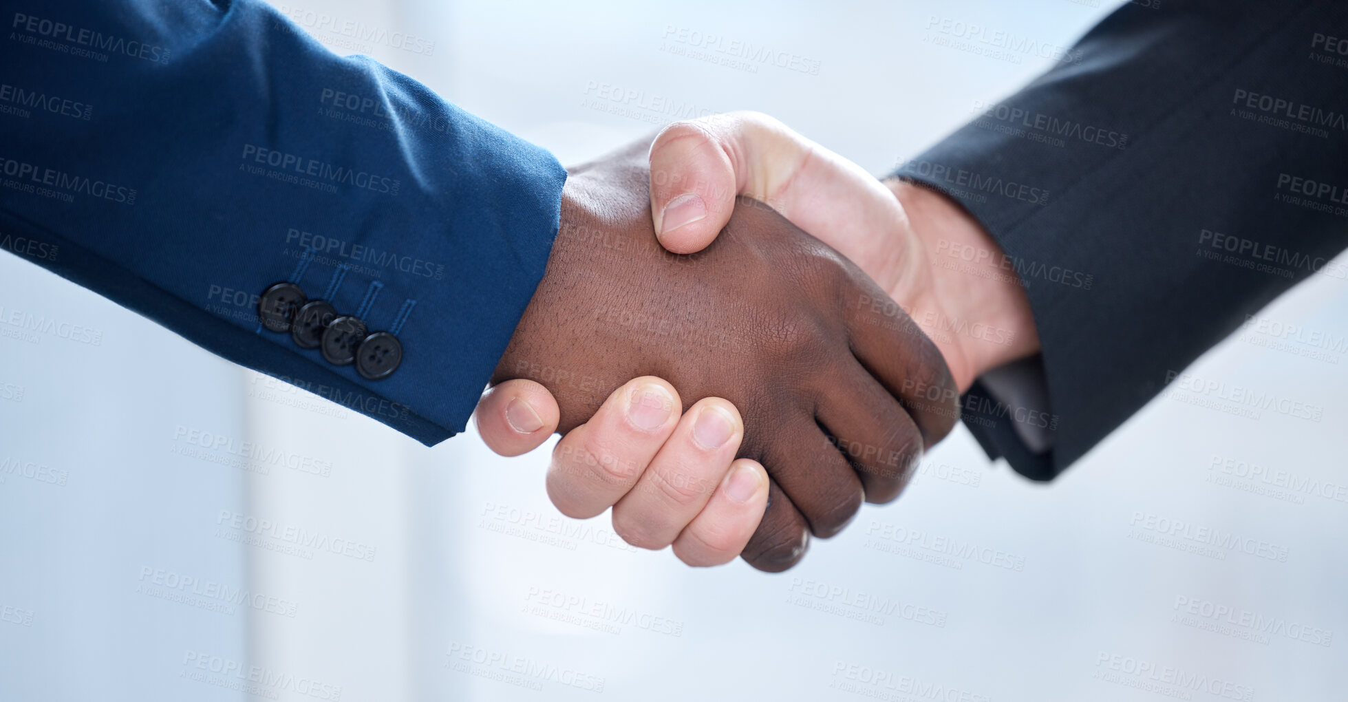 Buy stock photo Shot of two unrecognizable businesspeople shaking hands at work