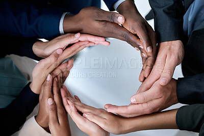 Buy stock photo Cropped shot of a group of unrecognizable businesspeople joining their hands in solidarity