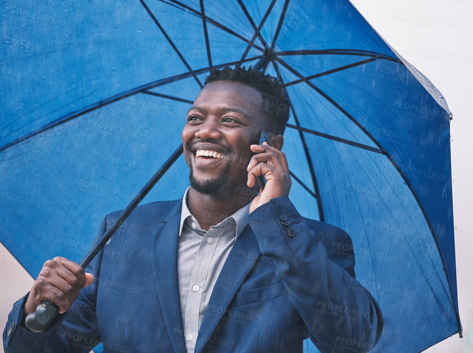 Buy stock photo Phone call, business and black man with umbrella, outdoor and communication with rain, smile and connection. Weather, African person and agent with cellphone, cover and network with app, city and wet
