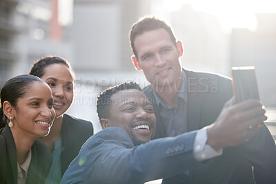 Buy stock photo Diversity, group of people take a selfie and with smartphone smile outdoors in a city background with a lens flare. Happiness, collaboration and colleagues in urban street together with smile